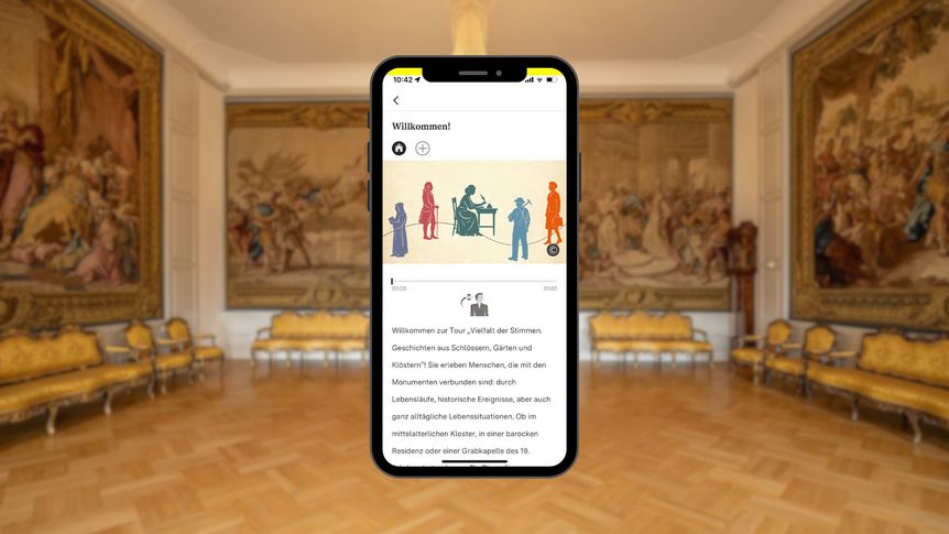 Smartphone mit Vielfalt-Tourstation vor dem Coursaal vom Barockschloss Mannheim
